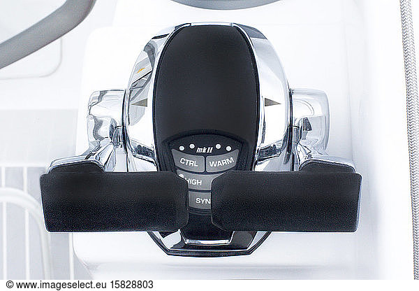 Details of a stainless engine control lever for boat power on a yacht