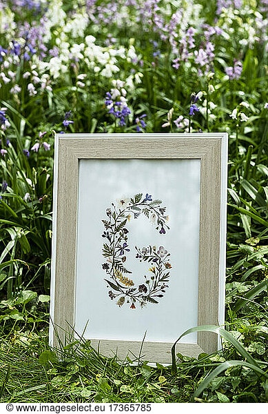 Details of floral letter G  decorations for a woodland naming ceremony