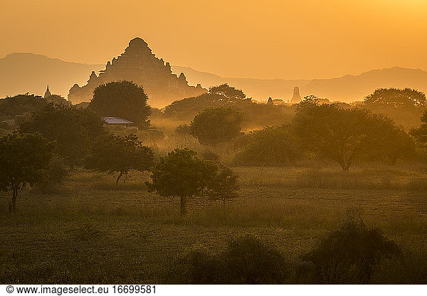 Dhammayangyi Temple against clear orange sky during sunset  UNESCO  Bagan  Myanmar