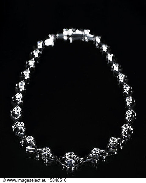 diamond necklace on black background