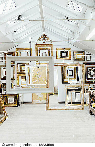 Different designs and patterns of frames hanging in studio