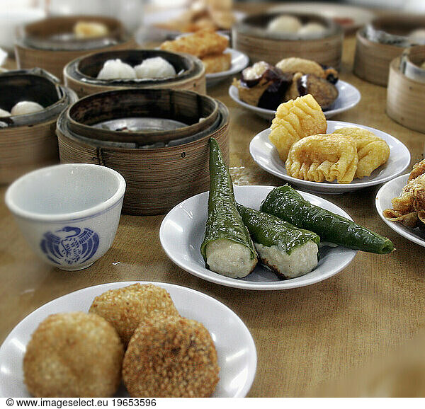 Dim sum dishes sit on a table in a Chinese Restaurant in Kuala Lumpur  Malaysia.