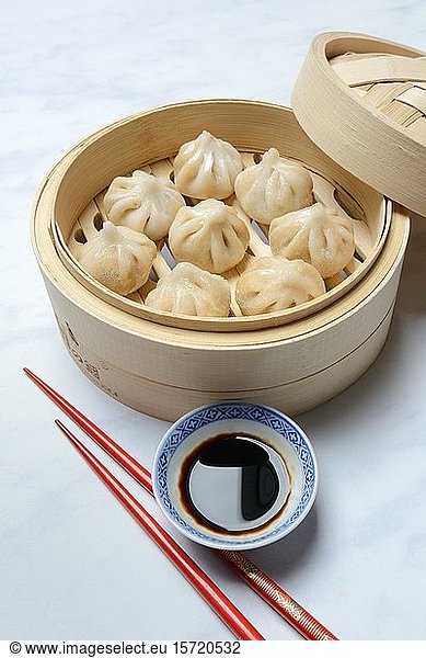 Dim Sum  filled dumplings  steamed in bamboo baskets with soy sauce and chopsticks  Germany  Europe