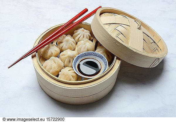 Dim Sum  filled dumplings  steamed in bamboo baskets with soy sauce and chopsticks  Germany  Europe