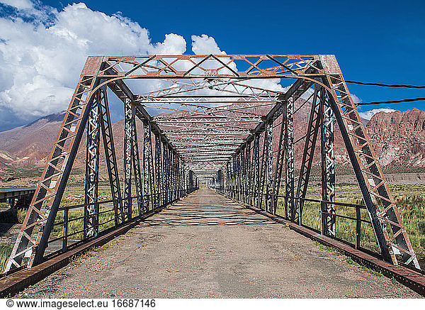 Diminishing perspective of old iron bridge  Uspallata  Mendoza