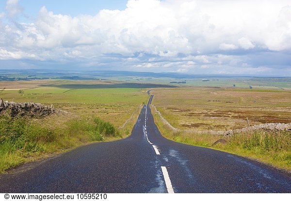 Diminishing perspective of rural road  Cumbria  UK