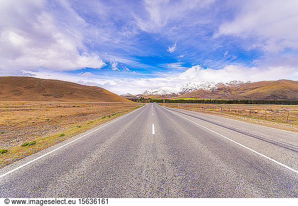 Diminishing view of State Highway 8 against sky  Tekapo  South Island  New Zealand