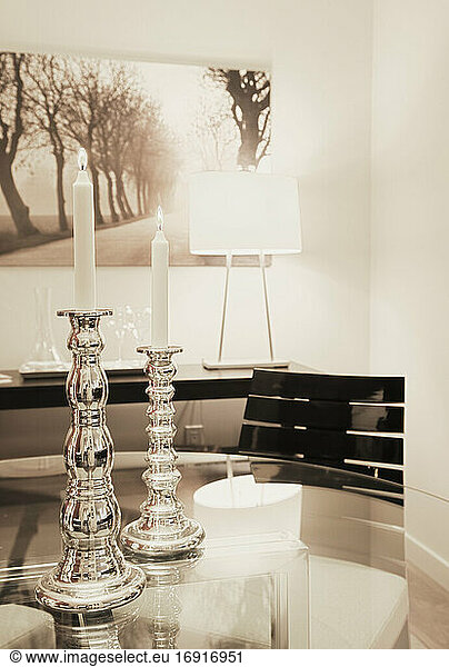 Dining table with candles in dining room.