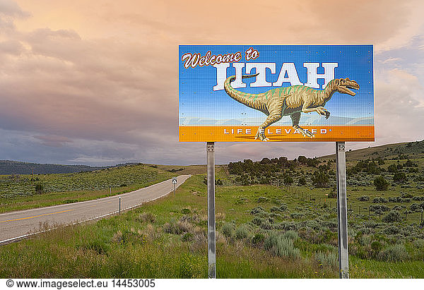 Dinosaur on Welcome to Utah sign along road  Utah  United States
