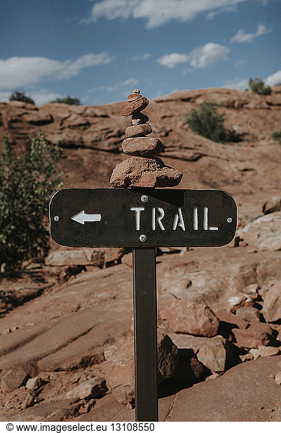 Directional sign at Arches National Park against sky