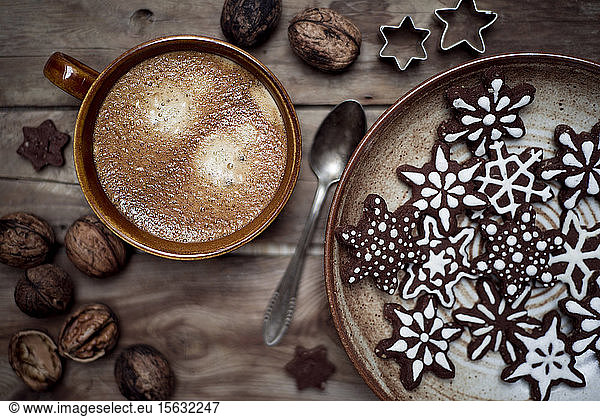 Directly above shot of Christmas cookies with coffee on table