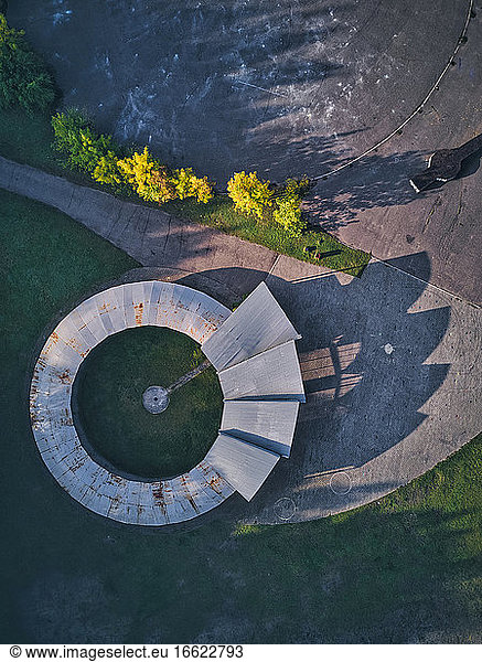 Directly above view of open-air theater with long shadow during sunset