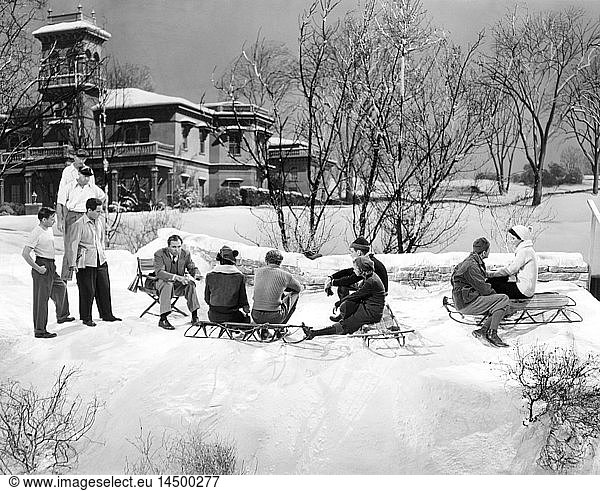 Director King Vidor  (seated  Left)  And cast prepare for snowball fight  on-set of the Film H.M. Pulham  Esq.  1941