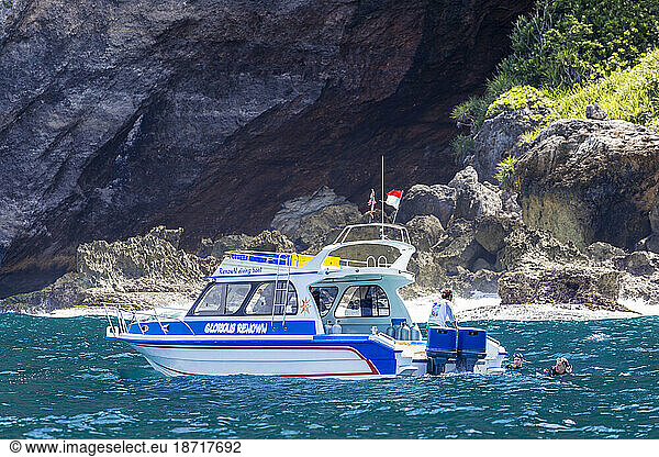Diver boat near Nusa Penida coasline.