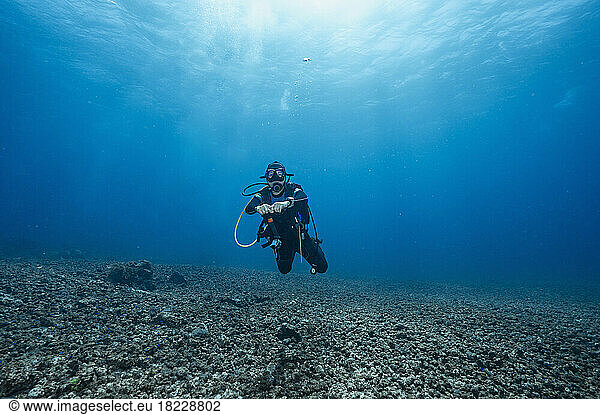 Diver exploring the ocean at Komodo / Indonesia