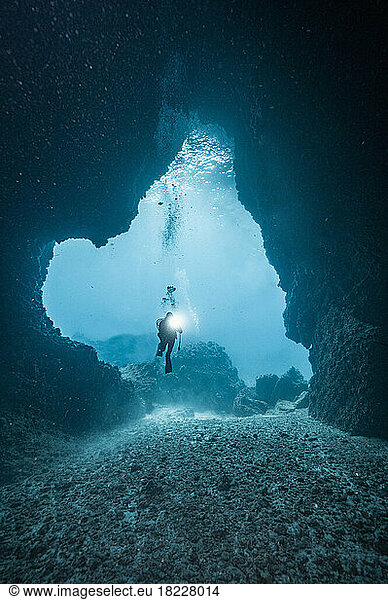 diver exploring underwater cave in the South Andaman Sea