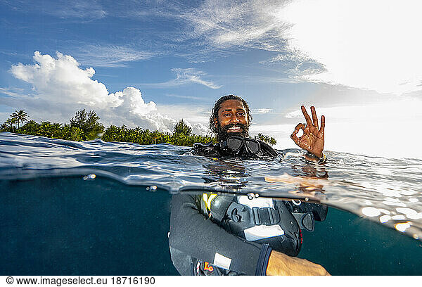diver floating on the surface after a dive in the Maldives