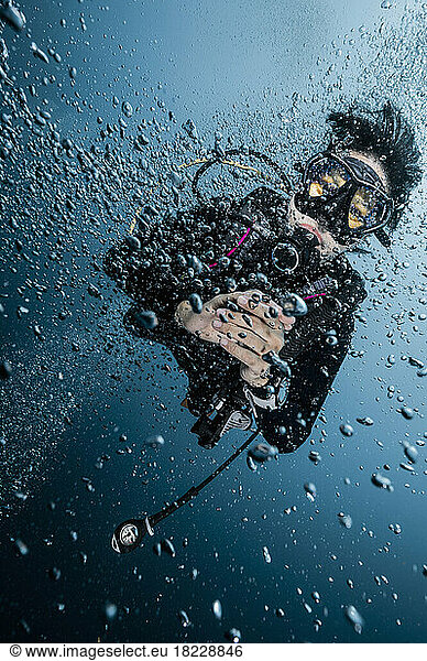 diver in a sea of bubbles in the gulf of Thailand