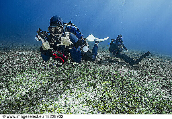Diver's exploring the ocean floor at Komodo / Indonesia