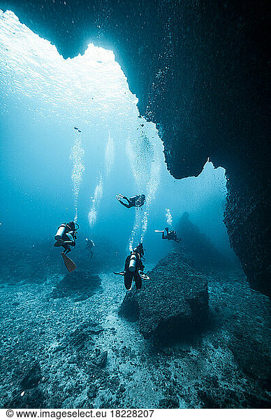 diver's exploring underwater cave in the South Andaman Sea