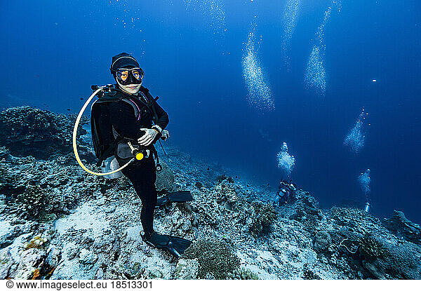 diver standing on the ocean floor at Banda Sea / Indonesia