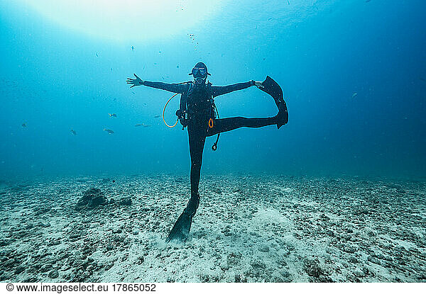 diver stretching under water at the Andaman Sea in Thailand