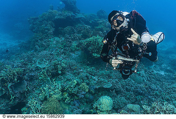 Diver with underwater camera posing at Great Barrier Reef
