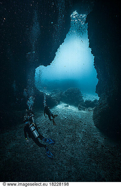 divers exploring underwater cave in the South Andaman Sea