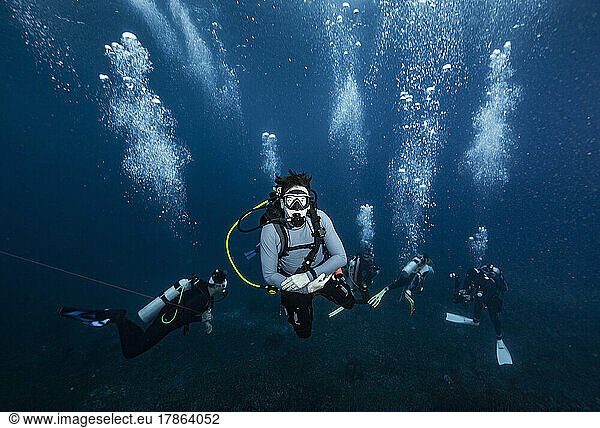divers performing a mandatory safety stop at the Andaman Sea