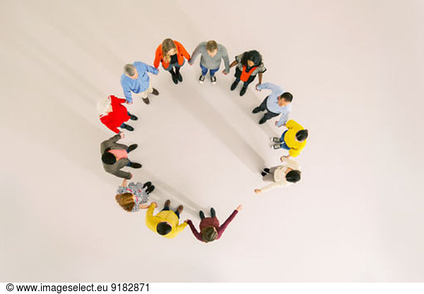 Diverse group forming circle