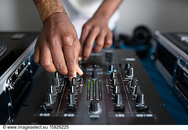 DJ's hands mixing music
