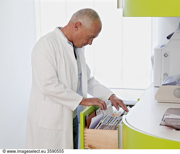 Doctor browsing patient files