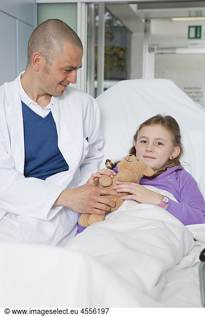 Doctor caring about little patient