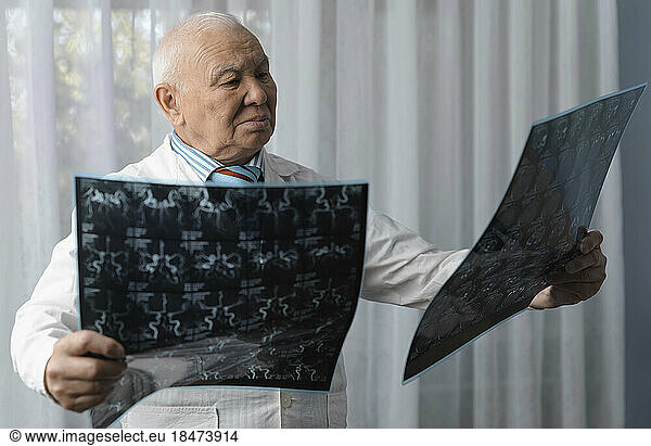 Doctor examining x-ray Images at hospital