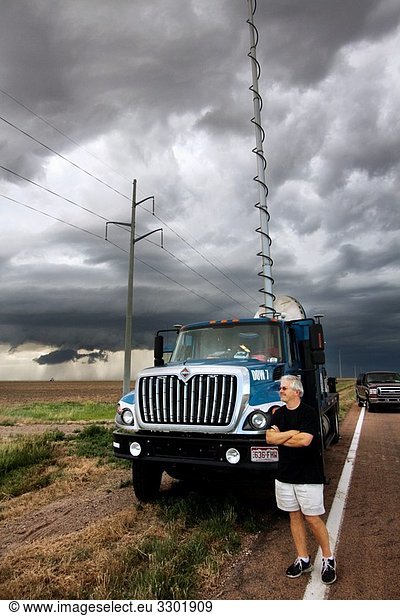 Doctor Josh Wurman of the Center for Severe Weather Research stands in front of DOW 7  one of his Doppler on Wheels trucks Wurman and the DOW trucks are participating in Project Vortex 2  a two year mission to study tornadoes