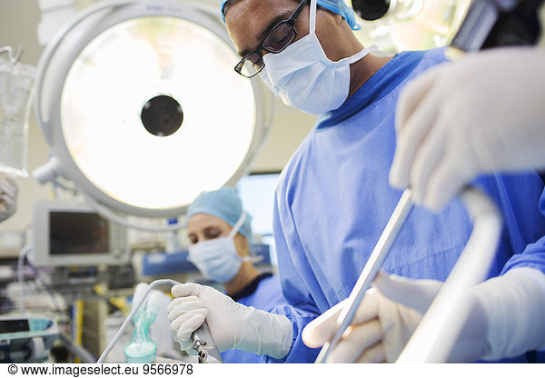 Doctor performing surgery in operating theater