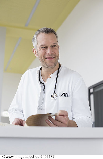 Doctor with file  smiling