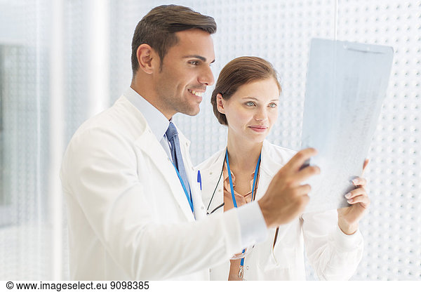 Doctors examining x-ray in hospital