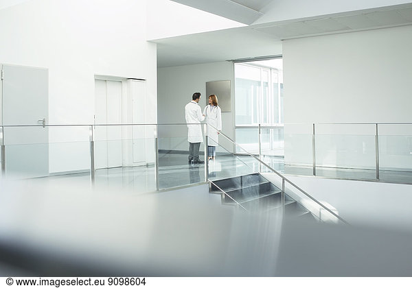 Doctors talking in hospital corridor