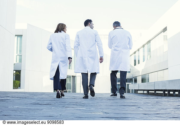 Doctors walking on rooftop