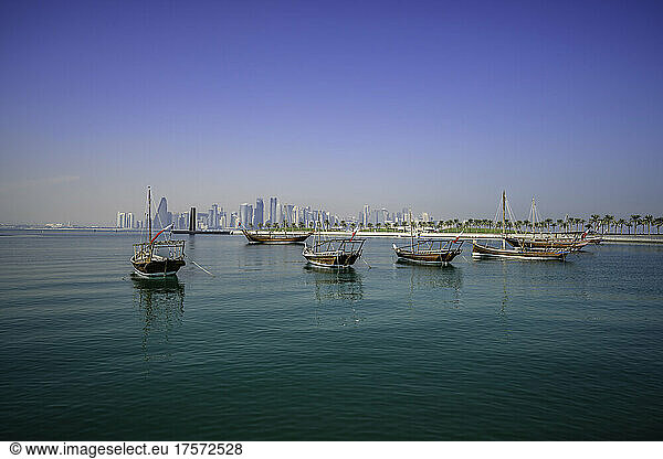 Doha skyline with dhow boats