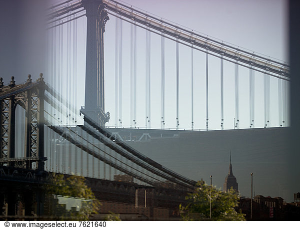Double exposure image of urban bridge