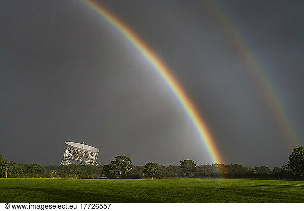 Double rainbow arching over the Jodrell Bank Lovell Radio Telescope  near Goostrey  Cheshire  England  United Kingdom  Europe