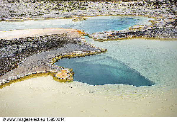 Doublet Pool features blue water and colorful sinter geyserite mats