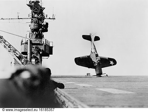 Douglas SBD 'Dauntless' Dive Bomber balanced on Nose after crash landing on Carrier Flight Deck  Pacific Ocean  Official U.S. Navy photo  June 21  1943