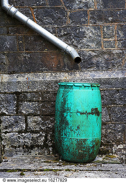 Drainpipe on housewall and barrel