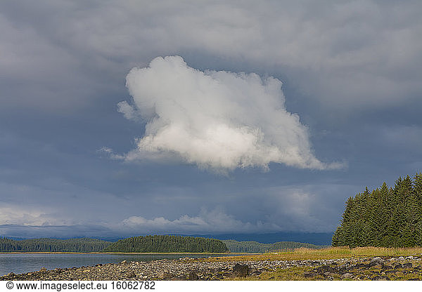 Dramatic storm clouds over remote coastline Muir Inlet Glacier Bay National Park and Preserve Alaska