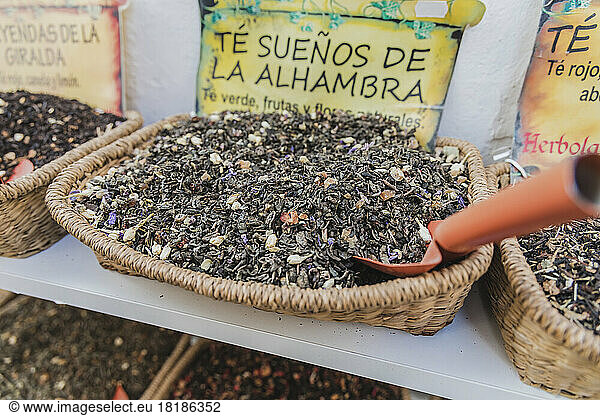 Dried tea leaves in basket for sale in market