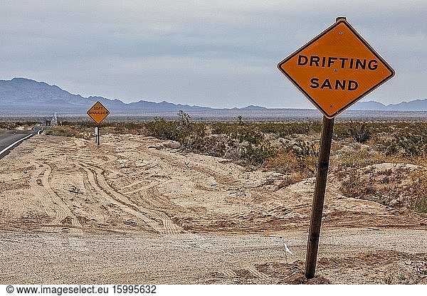Drifting sand road sign in Mojave Desert  Rice  California  USA.