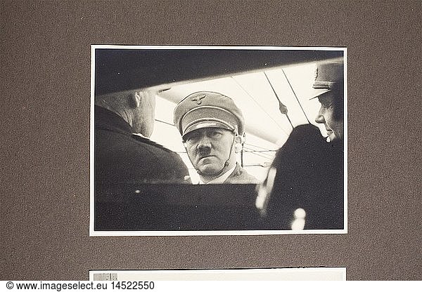 DRITTES REICH ZEITGESCHICHTE  Adolf Hitler  Album mit 51 Aufnahmen von seiner Yacht 'Aviso Grille' Die Aufnahmen im Format 8 x 11 cm  eingeklebt  vermutlich anlÃ¤sslich eines FlottenmanÃ¶vers aufgenommen: Hitler am Flugplatz bzw. an Bord mit Raeder  GÃ¶ring und von Blomberg  Ã¼ber Deck brechende Welle  Hitler mit der Crew  Detailaufnahmen anderer Schiffe  angetretene Crewmitglieder mit Ã„rmelabzeichen in Form des FÃ¼hrerstanders  Hitler mit Offizieren und Besatzungen  feuernde BordgeschÃ¼tze  U-Boote im Hafen  Hitler auf dem Turm bzw. beim Klettern in und aus der Luke eines U-Bootes u.v.m. Brauner Ledereinband mit vs. MÃ¼tzenband 'Aviso Grille'. In der Einbanddecke beschriftet 'Property of Lt. Daniel DeNicola... captured from Hitler's Home in Munich  Germany'. Dabei einige US-Zeitungsausschnitte mit Berichten Ã¼ber Lt. DeNicola und dieses Album. Hochinteressantes Album mit seltenen Aufnahmen  hÃ¶chstwahrscheinlich ein Geschenk der Besatzung der 'Aviso Grille' an Hitler